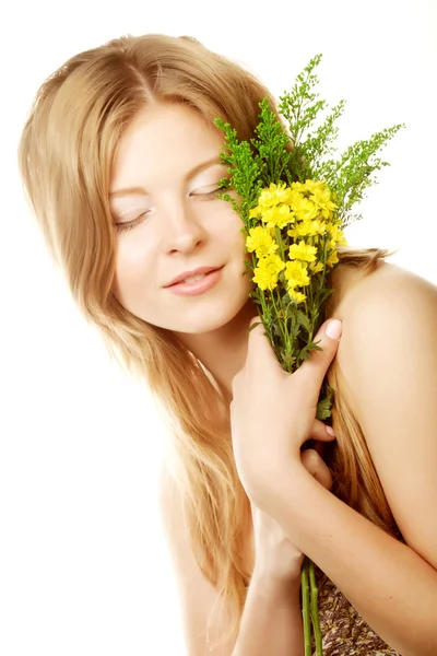 Woman with small yellow flowers — Stock Photo, Image