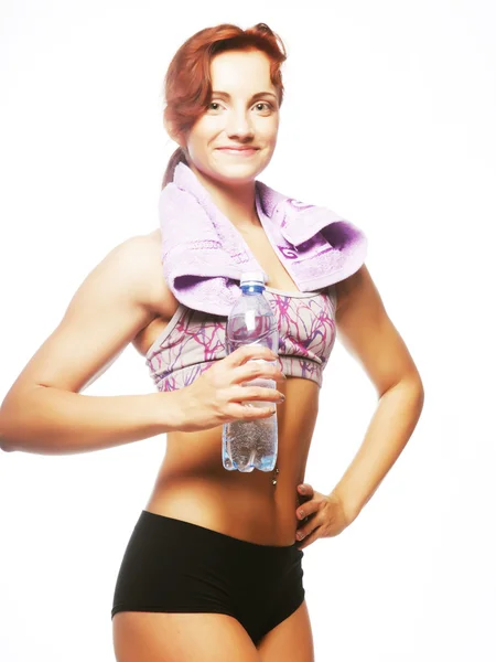 Sportliche Frau mit Mineralwasser — Stockfoto