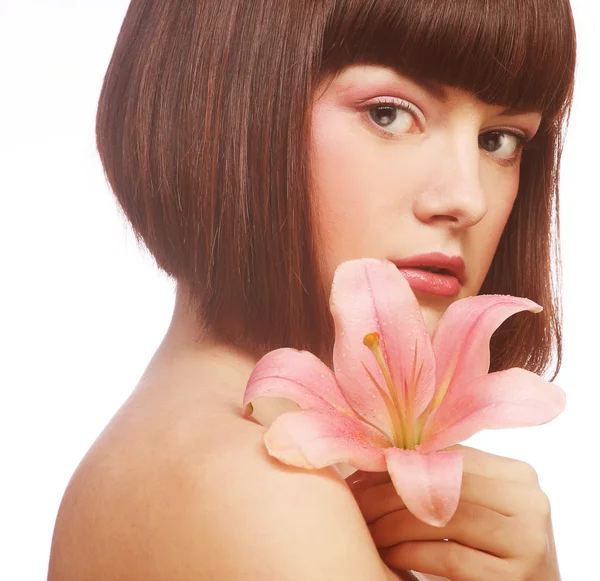 Beautiful woman with pink lily flower — Stock Photo, Image
