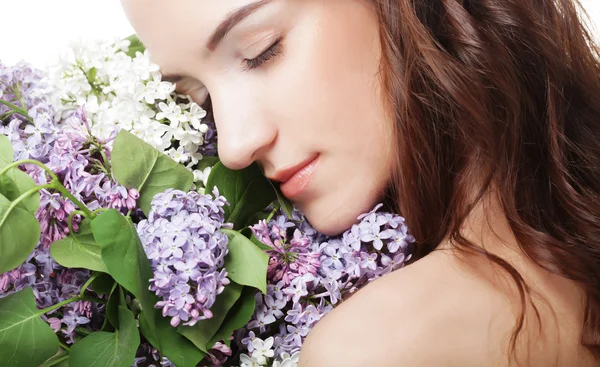 Menina primavera com flores lilás . — Fotografia de Stock