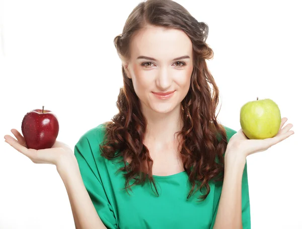 Woman with two different apples Royalty Free Stock Photos