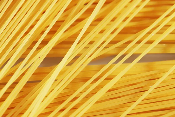 Ruwe pasta als hele achtergrond — Stockfoto