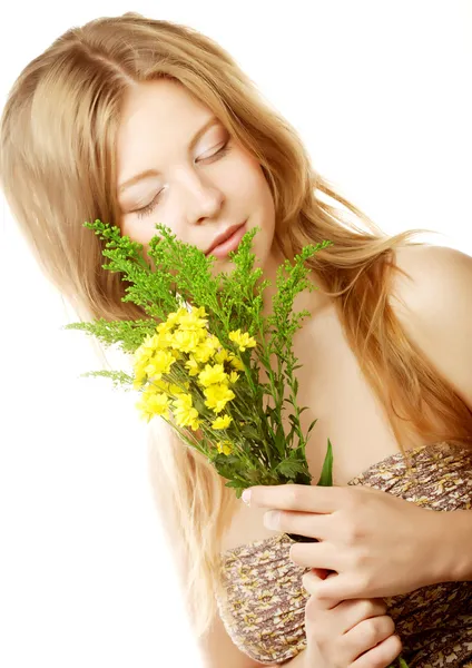 Woman with small yellow flowers — Stock Photo, Image