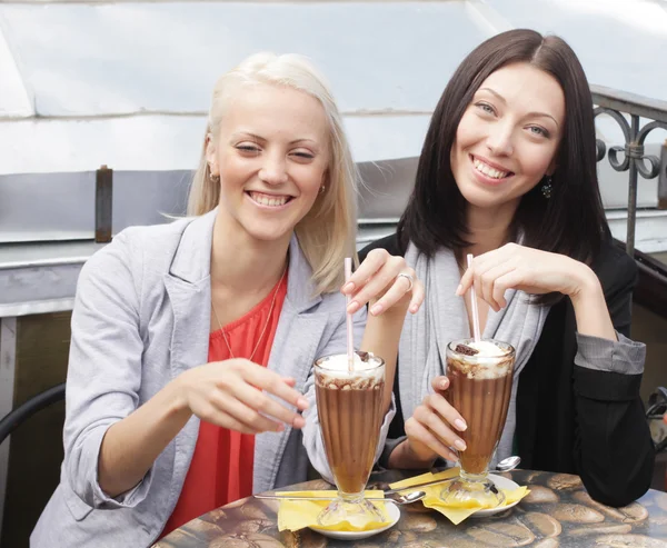 Smiling women drinking a coffee — Stock Photo, Image