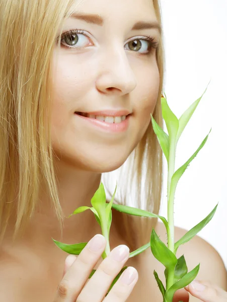 SPA. young woman with bamboo. — Stock Photo, Image