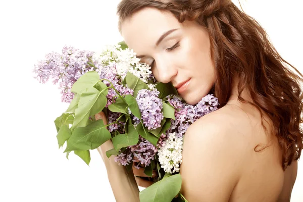 Menina primavera com flores lilás . — Fotografia de Stock