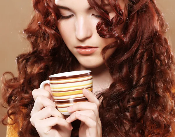 Young pretty woman drinking coffee — Stock Photo, Image