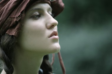 Fashion model posing in summer park