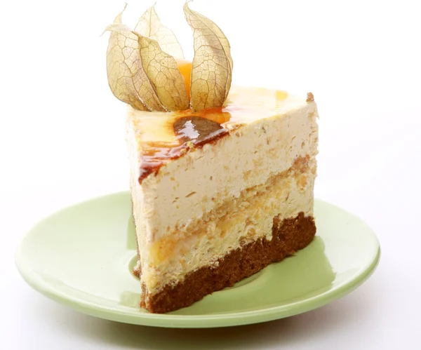 Cake on green saucer — Stock Photo, Image