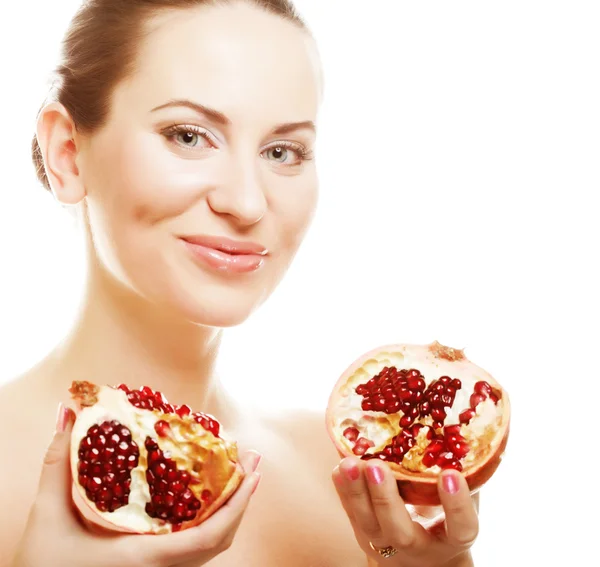 Woman showing pomegranate smiling. — Stock Photo, Image