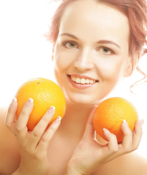 Beautiful woman's face with juicy orange — Stock Photo, Image