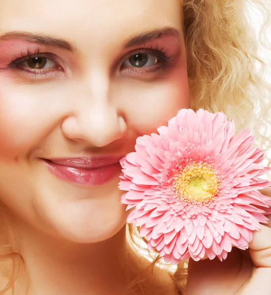 Beautiful woman with pink flower — Stock Photo, Image