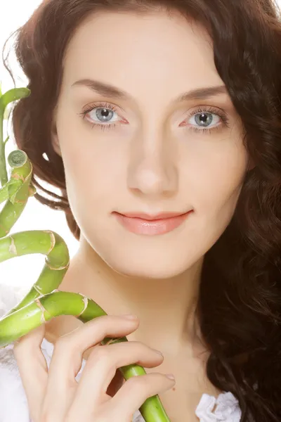 Young woman with bamboo. — Stock Photo, Image