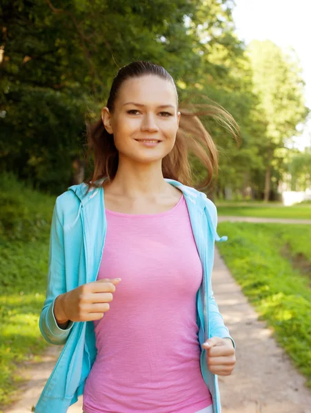 Young girl runner in the forest. — Stock Photo, Image