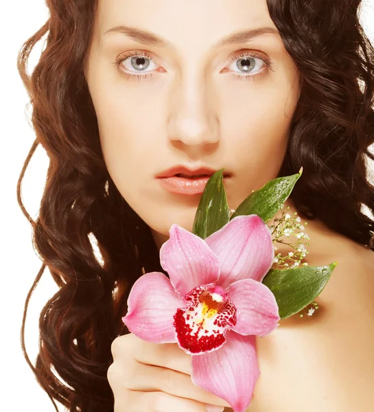 Woman and pink orchid — Stock Photo, Image