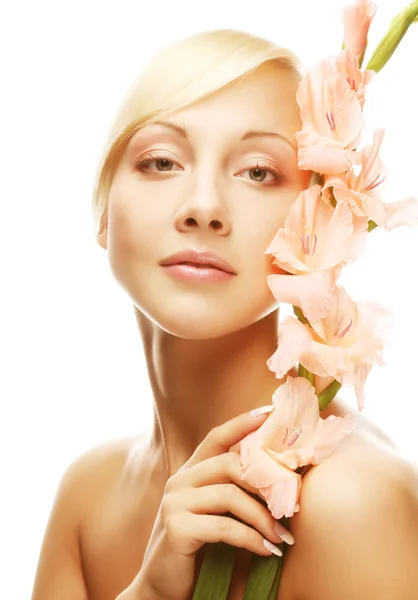 Woman with gladiolus flowers in her hands — Stock Photo, Image