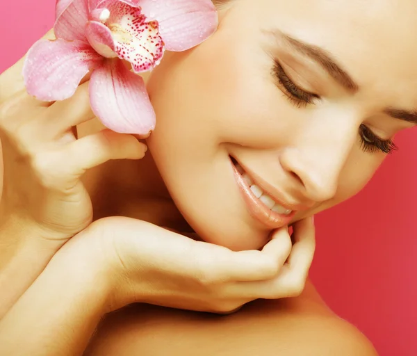 Happy woman with orchid flower — Stock Photo, Image