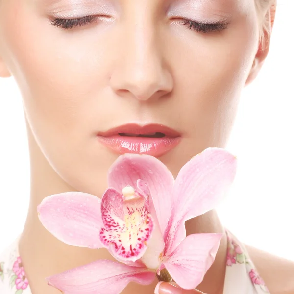 Beautiful woman with pink flower — Stock Photo, Image