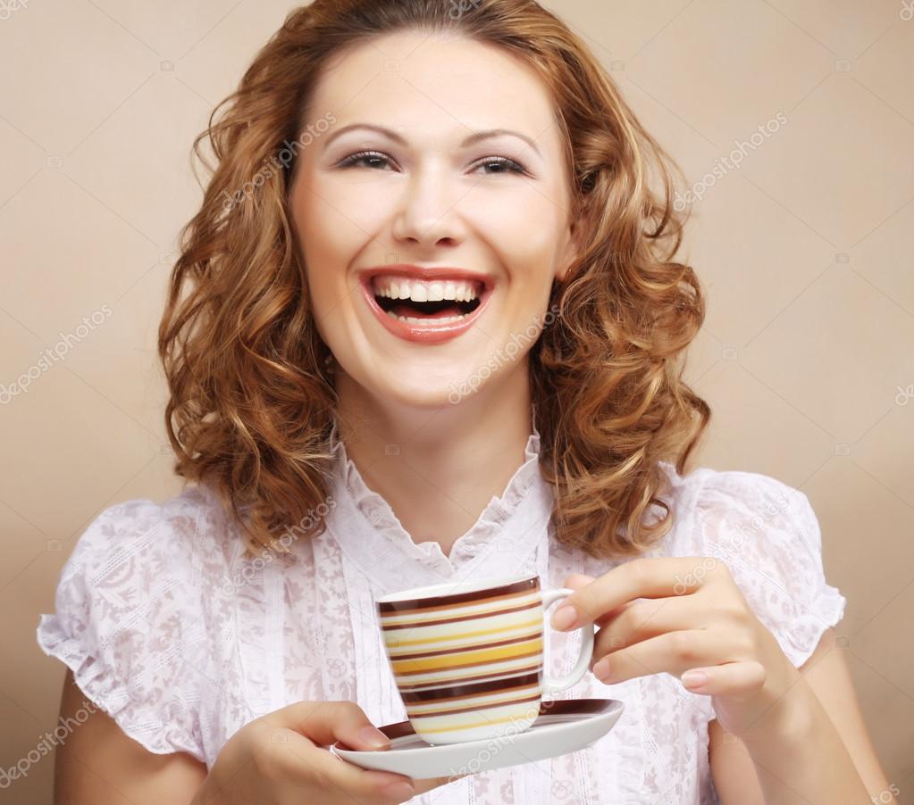 Pretty woman drinking coffee — Stock Photo © juice_team 41956497
