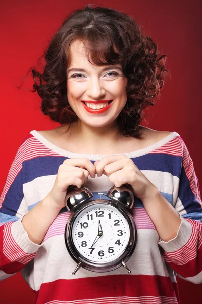 Beautiful woman with the clock — Stock Photo, Image