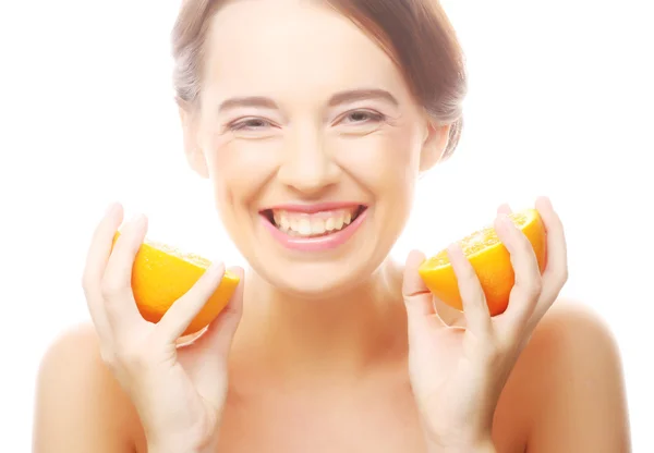 Cheerful woman with oranges in her hands — Stock Photo, Image