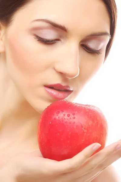 Brünette Frau mit rotem Apfel Stockbild