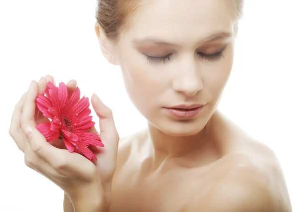 Beautiful young woman with gerber flower — Stock Photo, Image