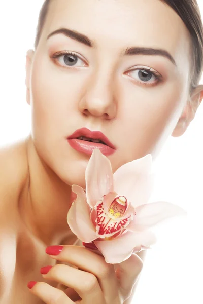 Beautiful woman with pink flower — Stock Photo, Image