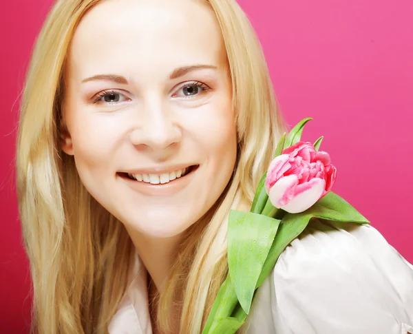 Blond woman with pink tulip — Stock Photo, Image