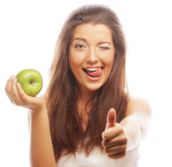 Kvinna med grönt äpple och visar tummen upp — Stockfoto