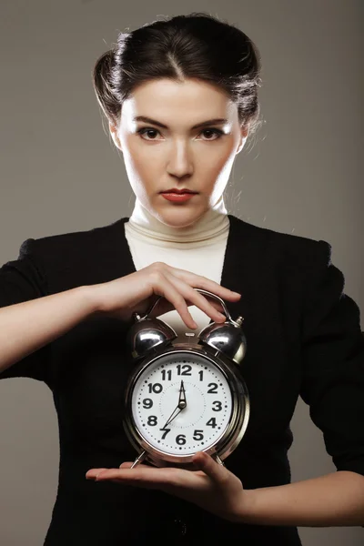 The business woman with an alarm clock — Stock Photo, Image