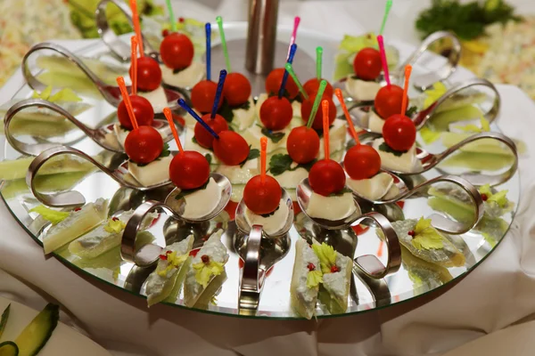 Catering table full of appetizing foods — Stock Photo, Image