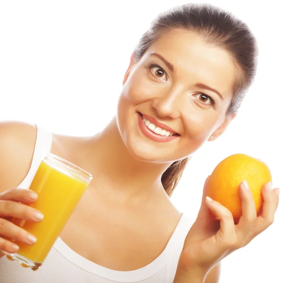 Young happy woman drinking orange juice. Royalty Free Stock Photos