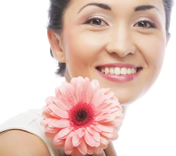 Beautiful young woman with gerber flower — Stock Photo, Image