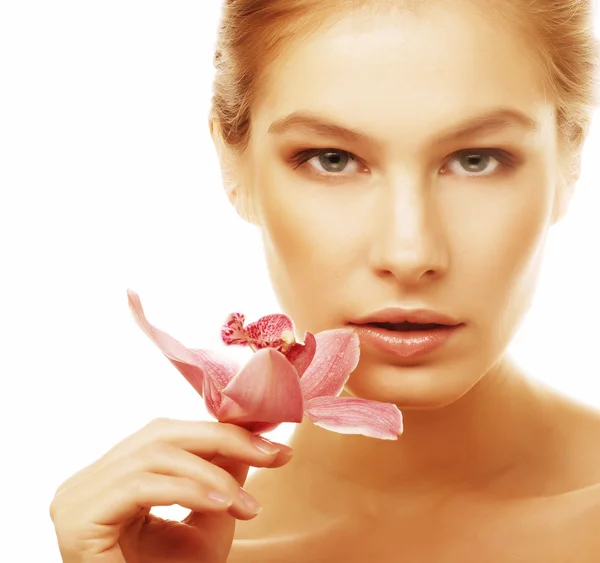 Mulher com orquídea rosa — Fotografia de Stock