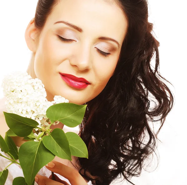 Frau mit weißen Blumen — Stockfoto