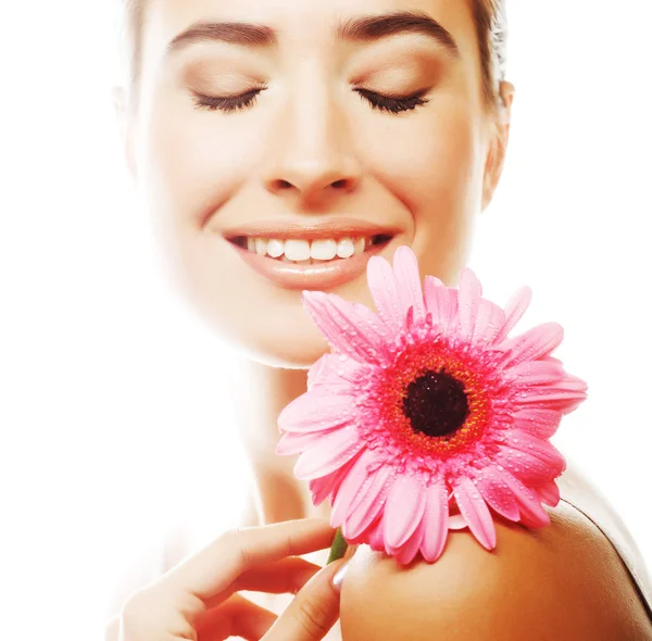 Beautiful woman with pink flower — Stock Photo, Image