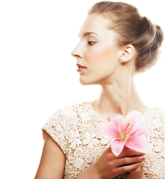 Blond girl with pink flower on white background — Stock Photo, Image