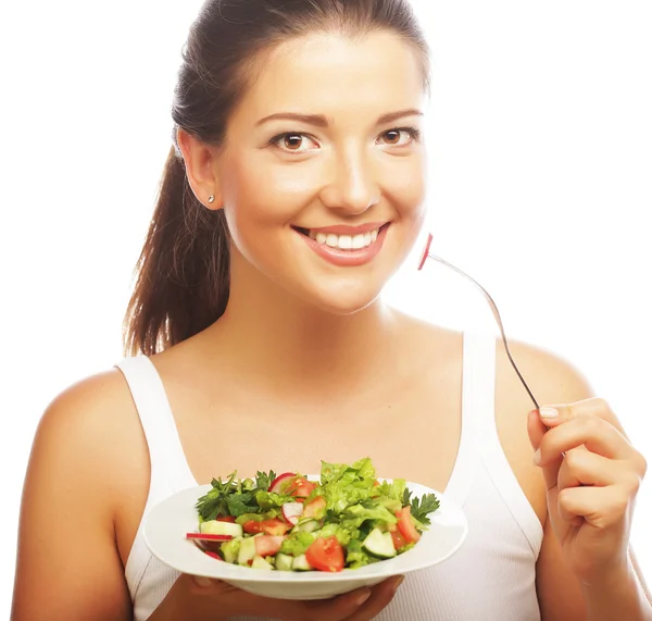 Mulher com salada no fundo branco — Fotografia de Stock