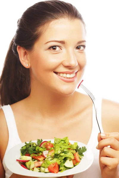 Mujer joven comiendo salat — Foto de Stock