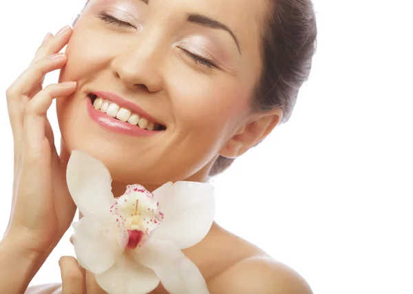 Beautiful woman face with  orchid flower — Stock Photo, Image
