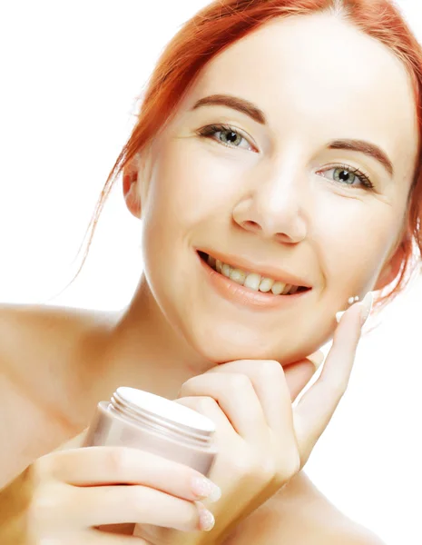 Young smiling woman applying cream — Stock Photo, Image