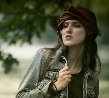 Fashion model posing in summer park