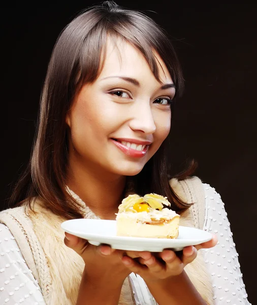 Jonge vrouw met een taart Rechtenvrije Stockfoto's