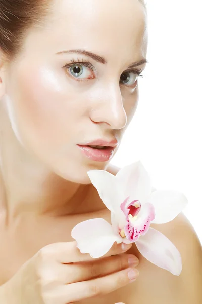 Mujer con flor de orquídea —  Fotos de Stock