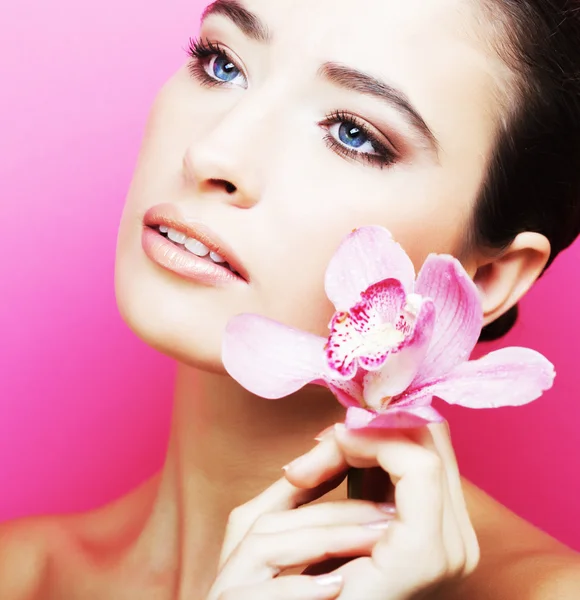 Happy woman with orchid flower — Stock Photo, Image