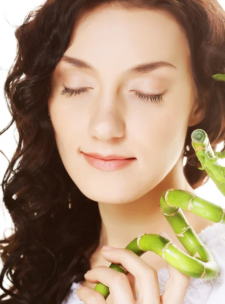 Young woman with bamboo. — Stock Photo, Image