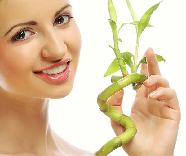 Young beautiful woman with bamboo — Stock Photo, Image