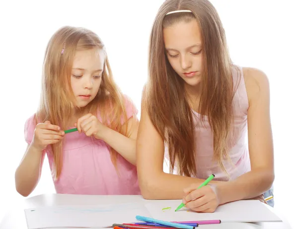 Sisters draw on the album — Stock Photo, Image