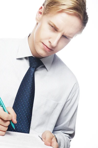 Young businessman with pen and documents — Stock Photo, Image